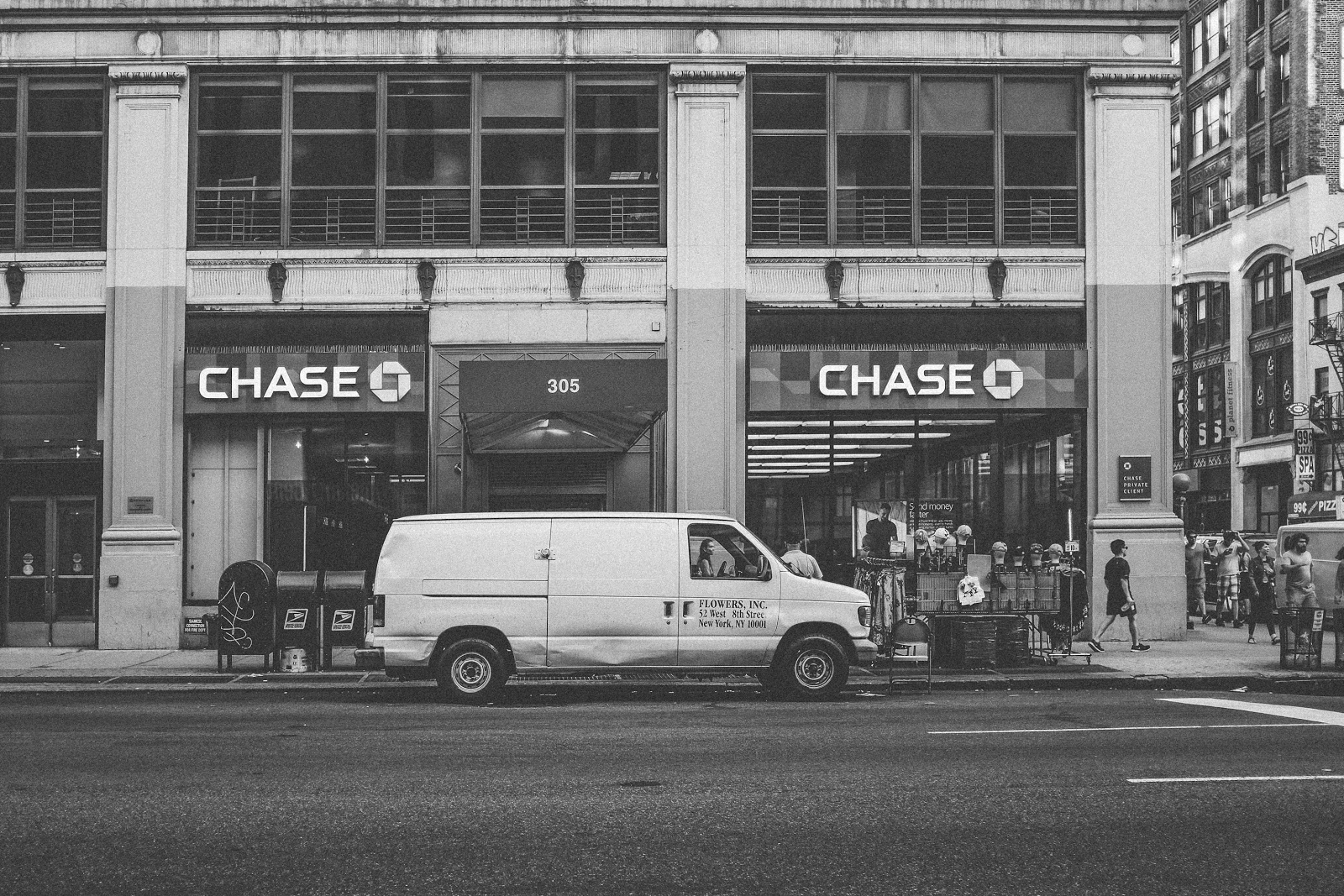 Chase retail bank on a main road with a white van parked out front