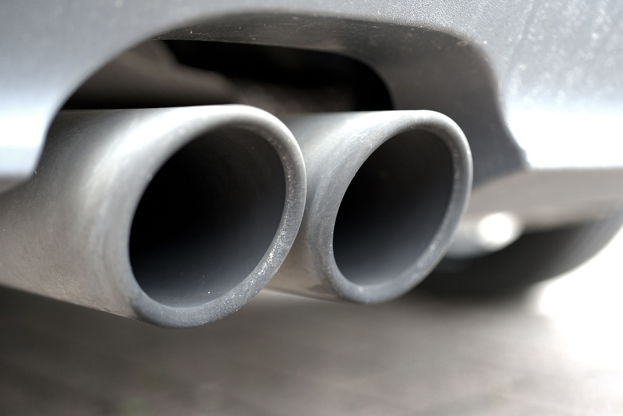 Close-up picture of the twin exhaust pipes of a diesel car.