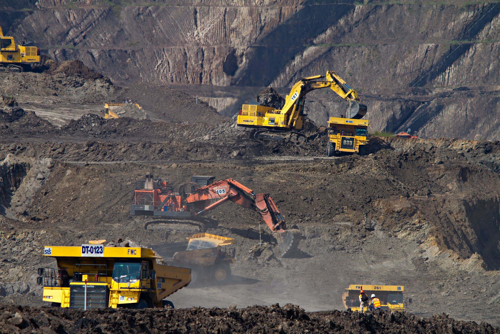 Yellow diggers working in a quarry