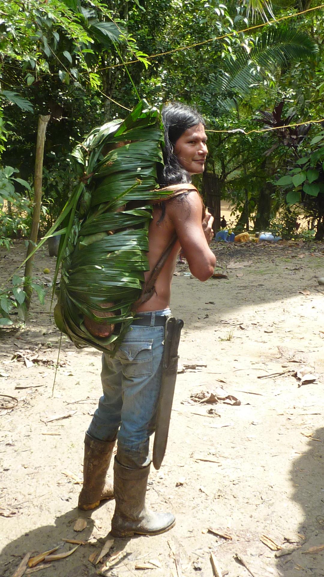 Sarayaku with backpack made from leaves